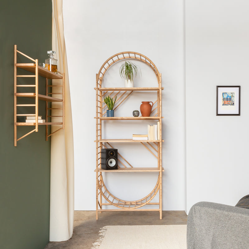 arched freestanding wooden ladder shelving by John Eadon single unit set livingroom alcove