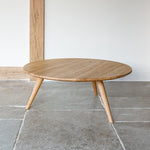 Three legged low round coffee table