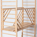 freestanding wooden ladder shelving by John Eadon full depth shelf